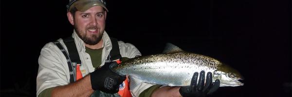 Stephen Smith holds a fish